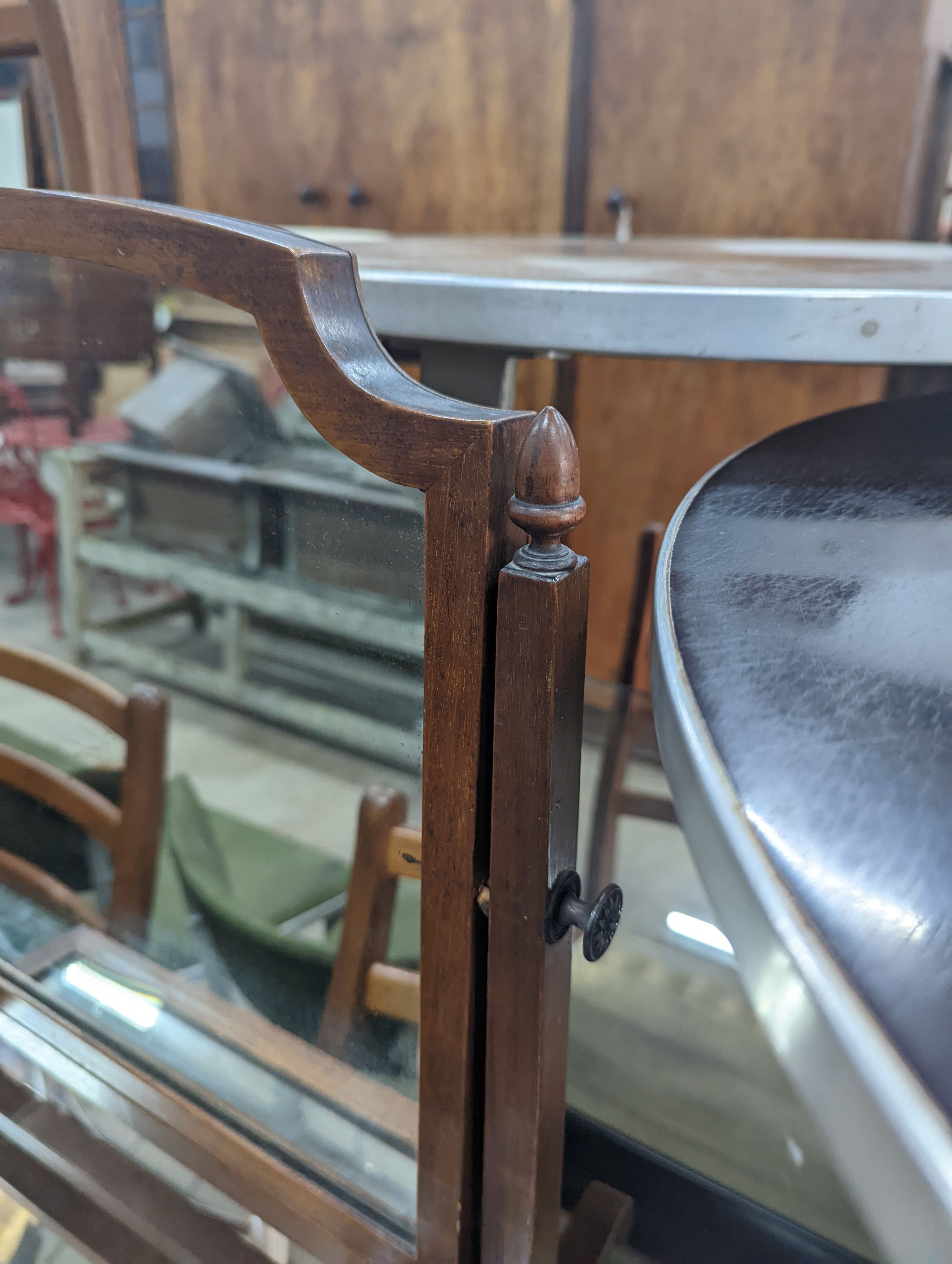 An Edwardian mahogany skeleton framed toilet mirror, width 54cm, depth 23cm, height 48cm together with a wall mirror